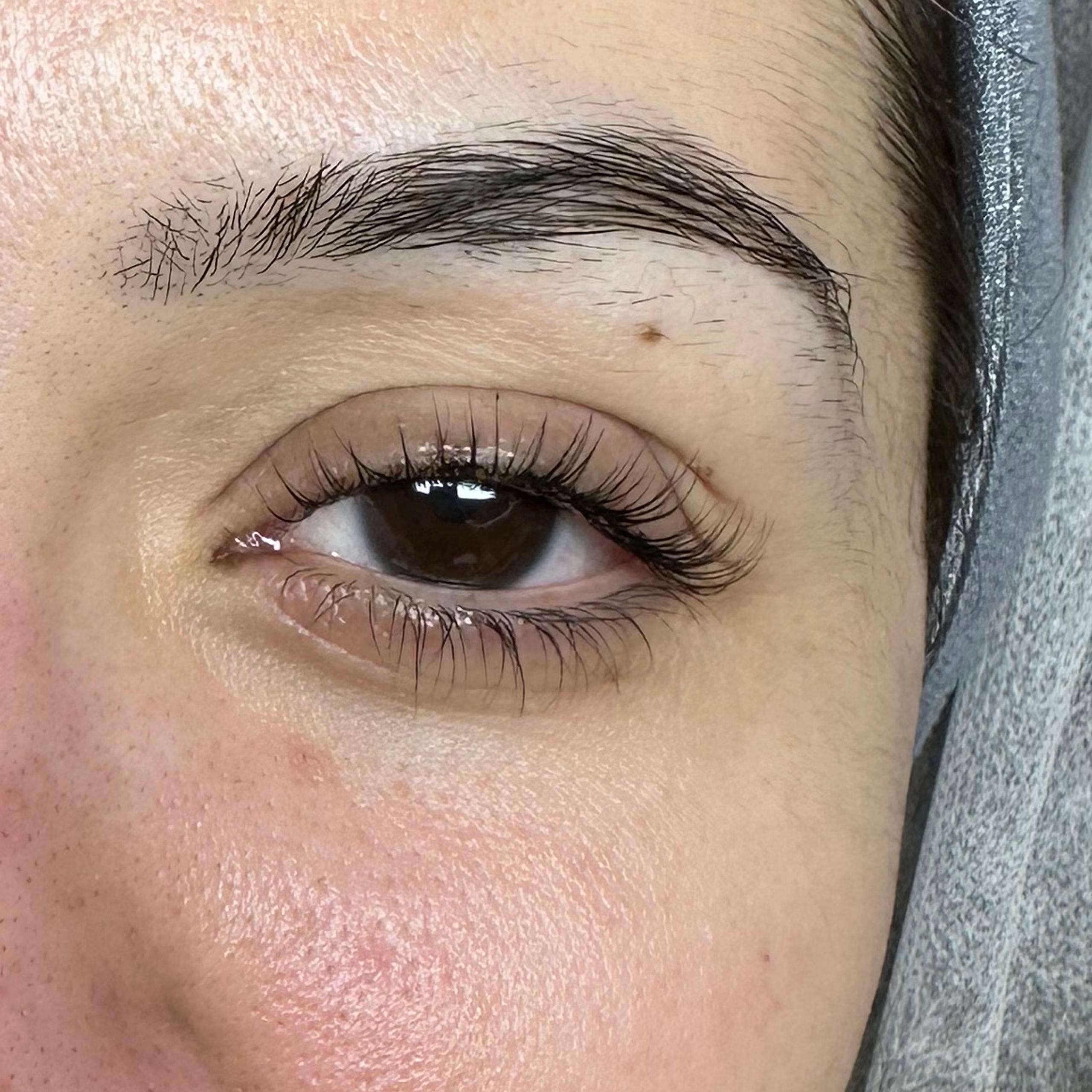 Right eye with long, curled lashes after treatment.