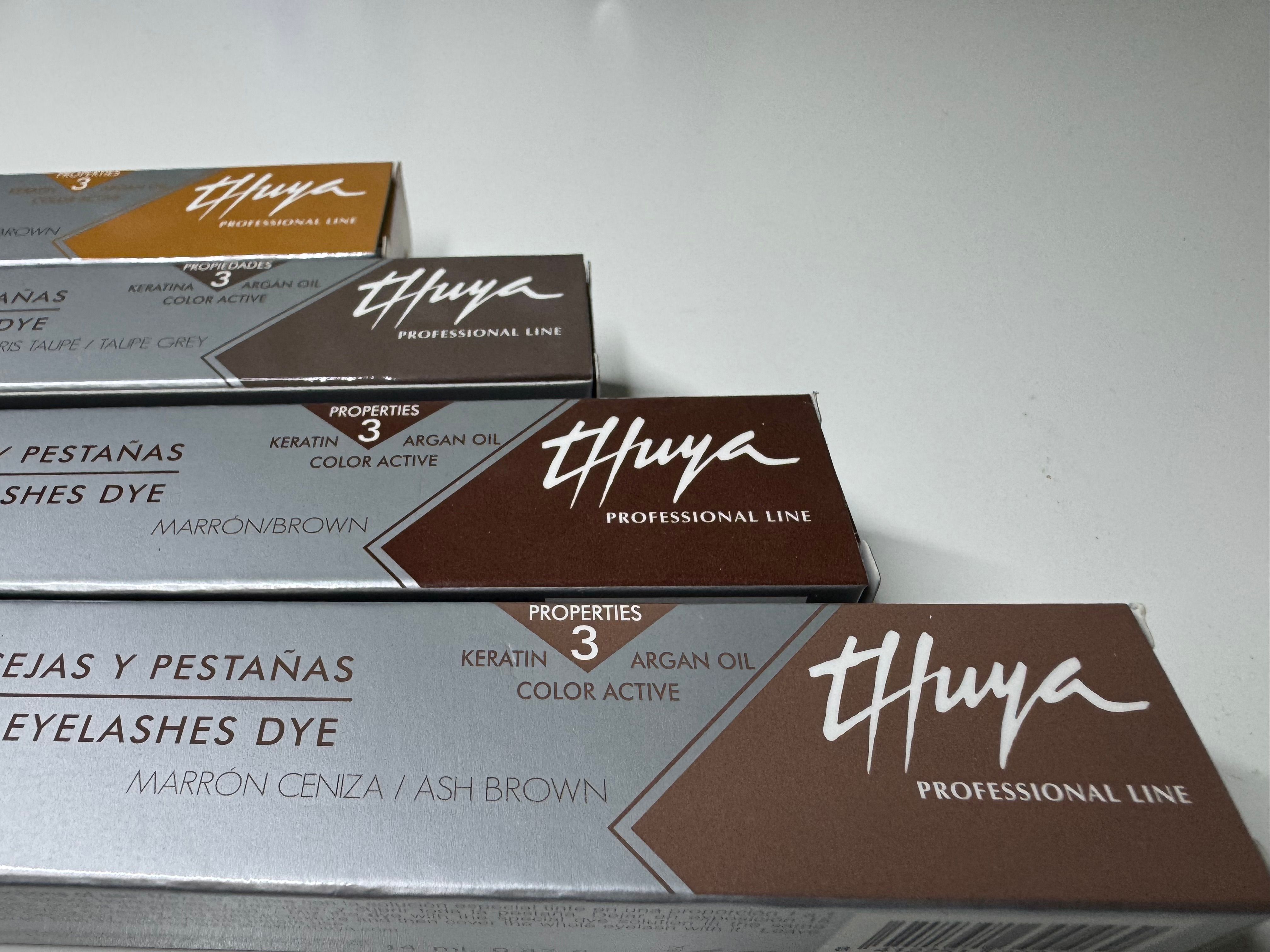 Thuya eyebrow and eyelash tint boxes in several brown and taupe shades.