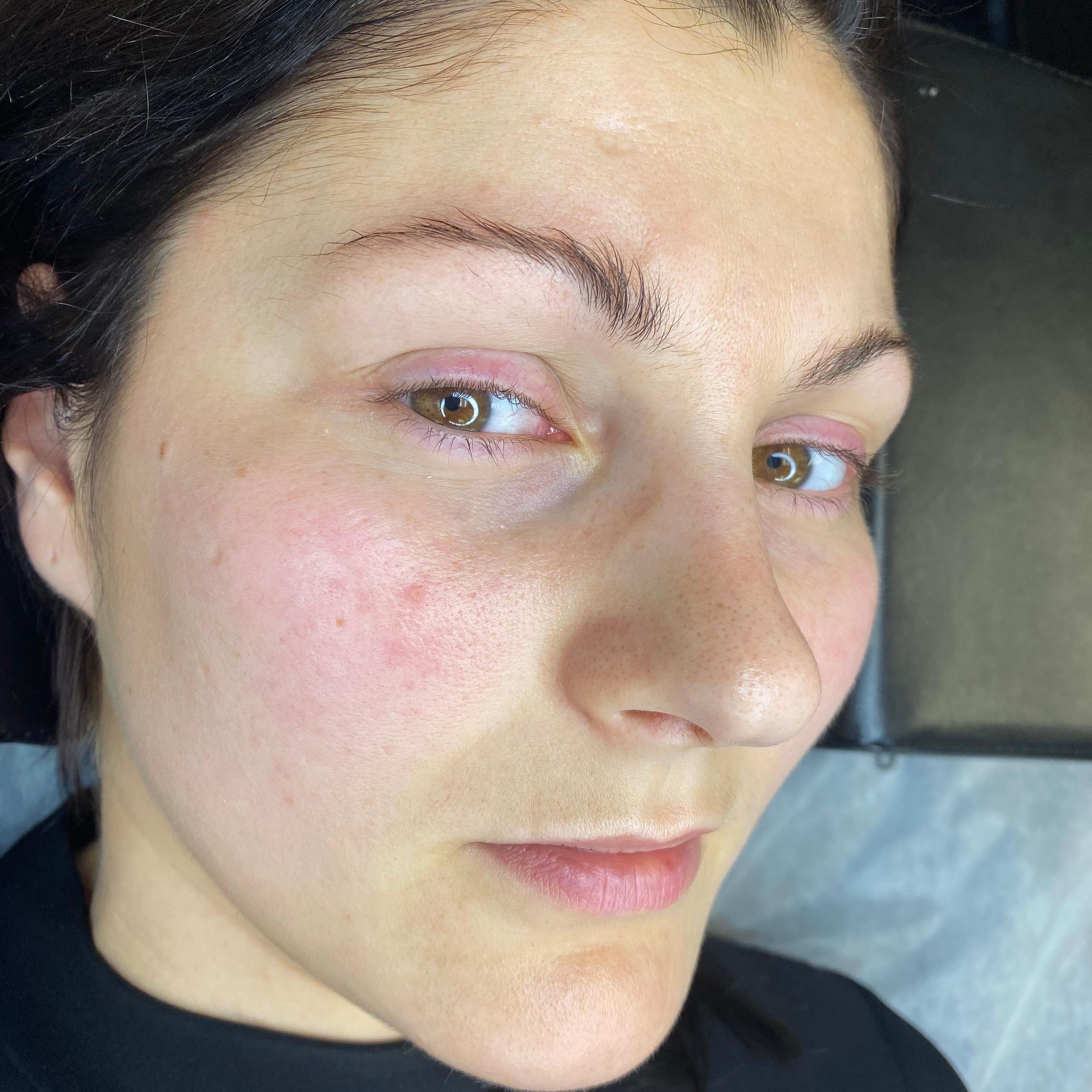 Close-up of a woman's face with natural eyelashes
