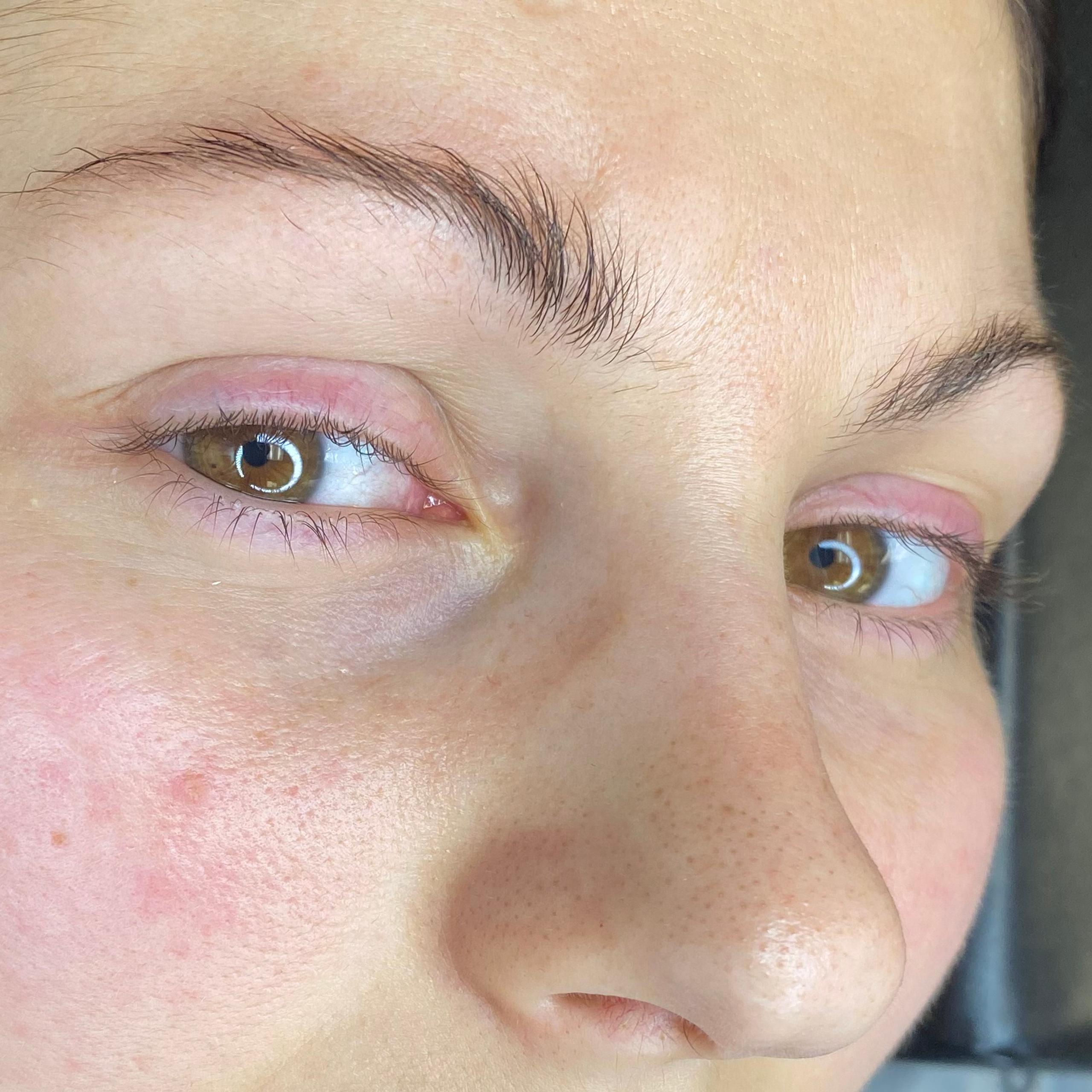 Close-up of a woman's face with natural eyelashes