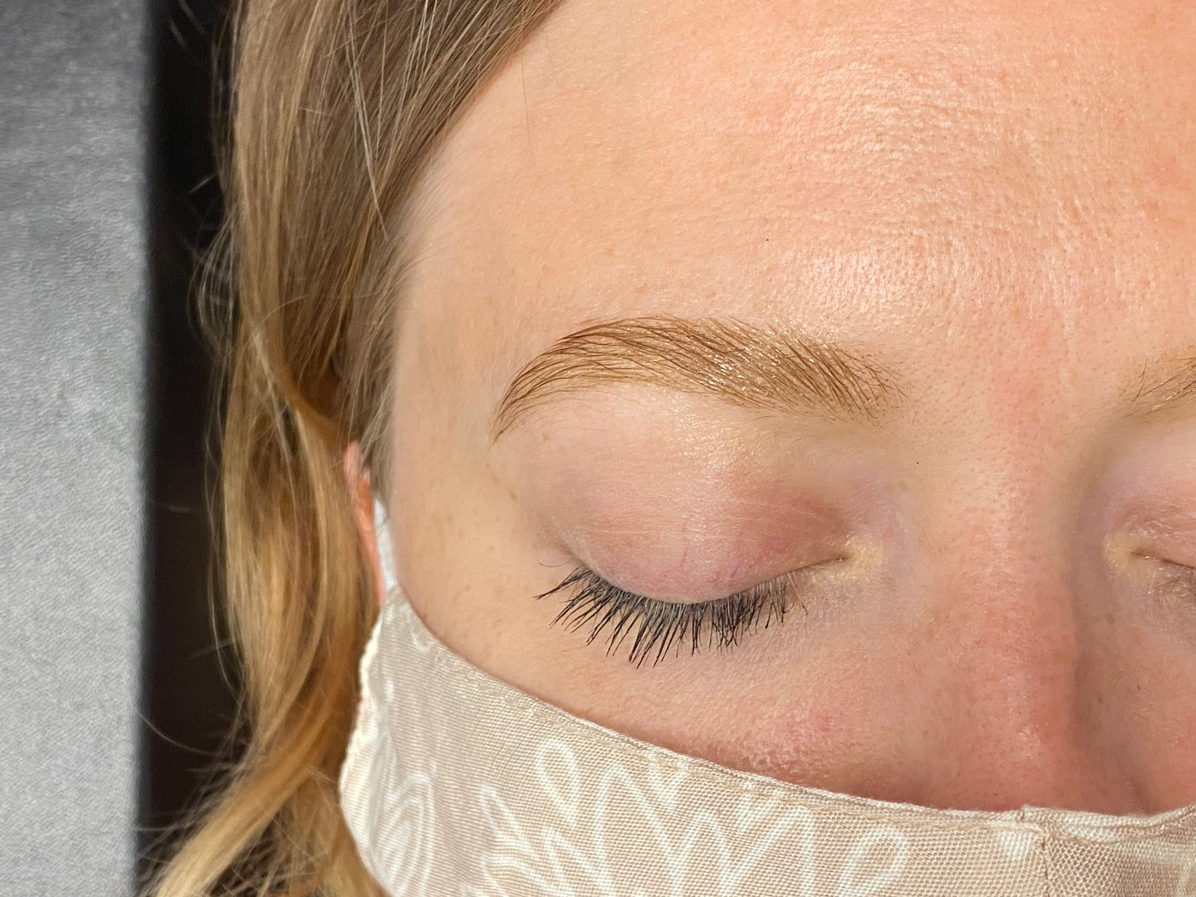 After brow tinting: the same eyebrow looks darker, fuller, and more defined.