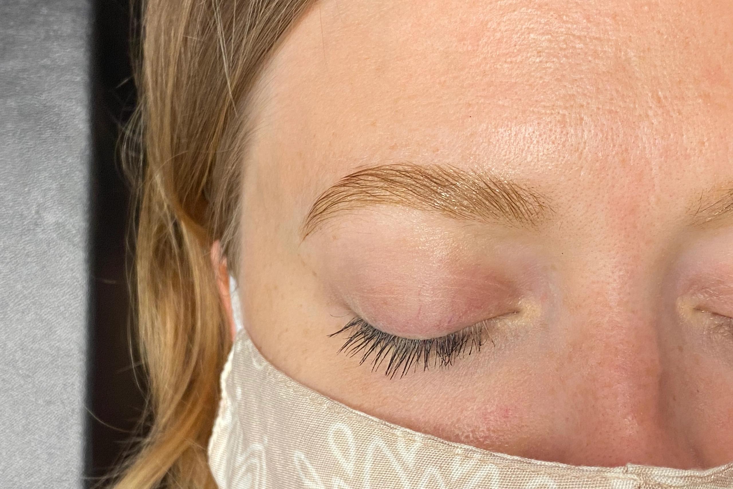 Close-up of a client's clean, defined eyebrow after tinting.