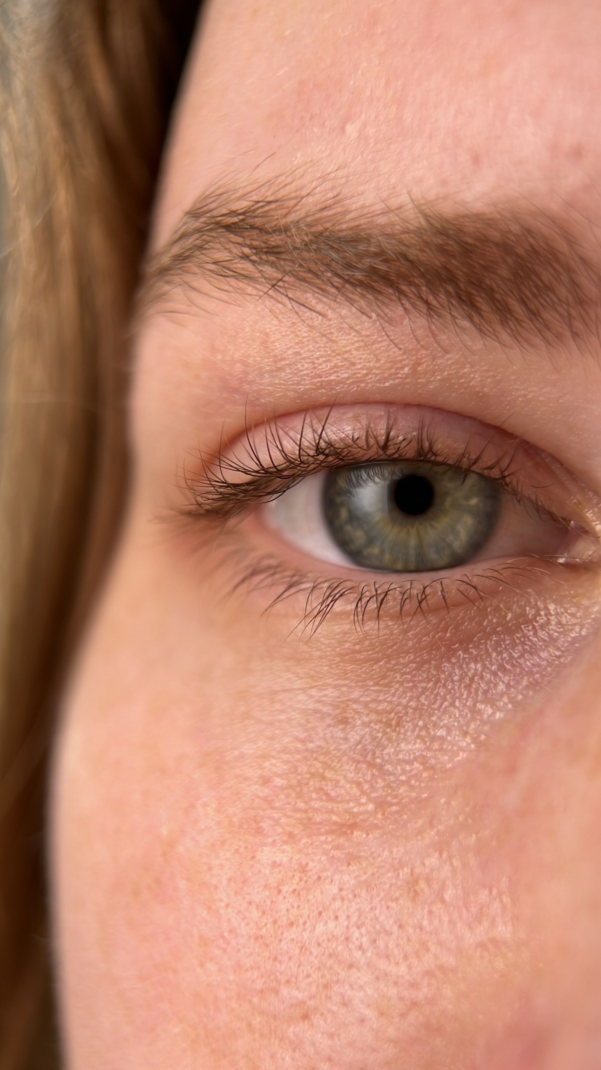 A women's natural eyelashes close up