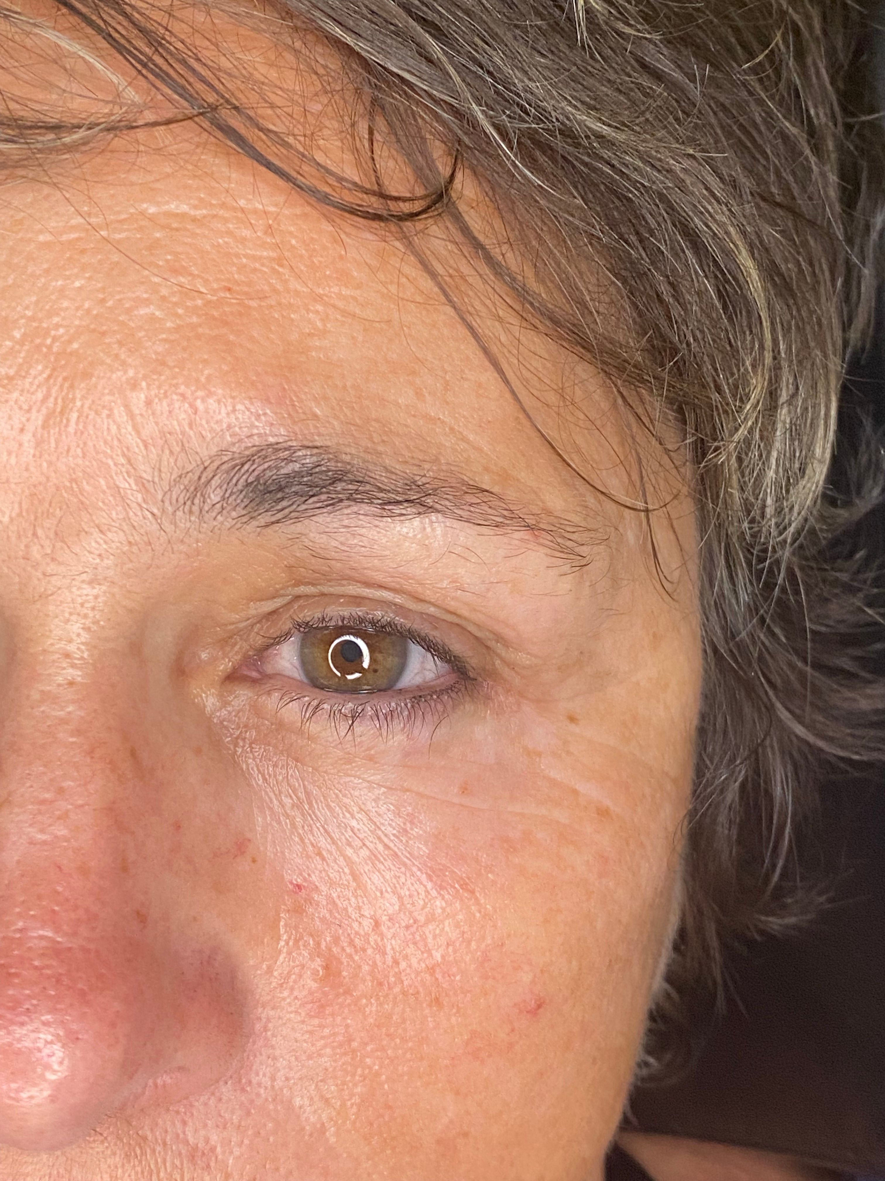 Close-up of short natural lashes before eyelash extensions
