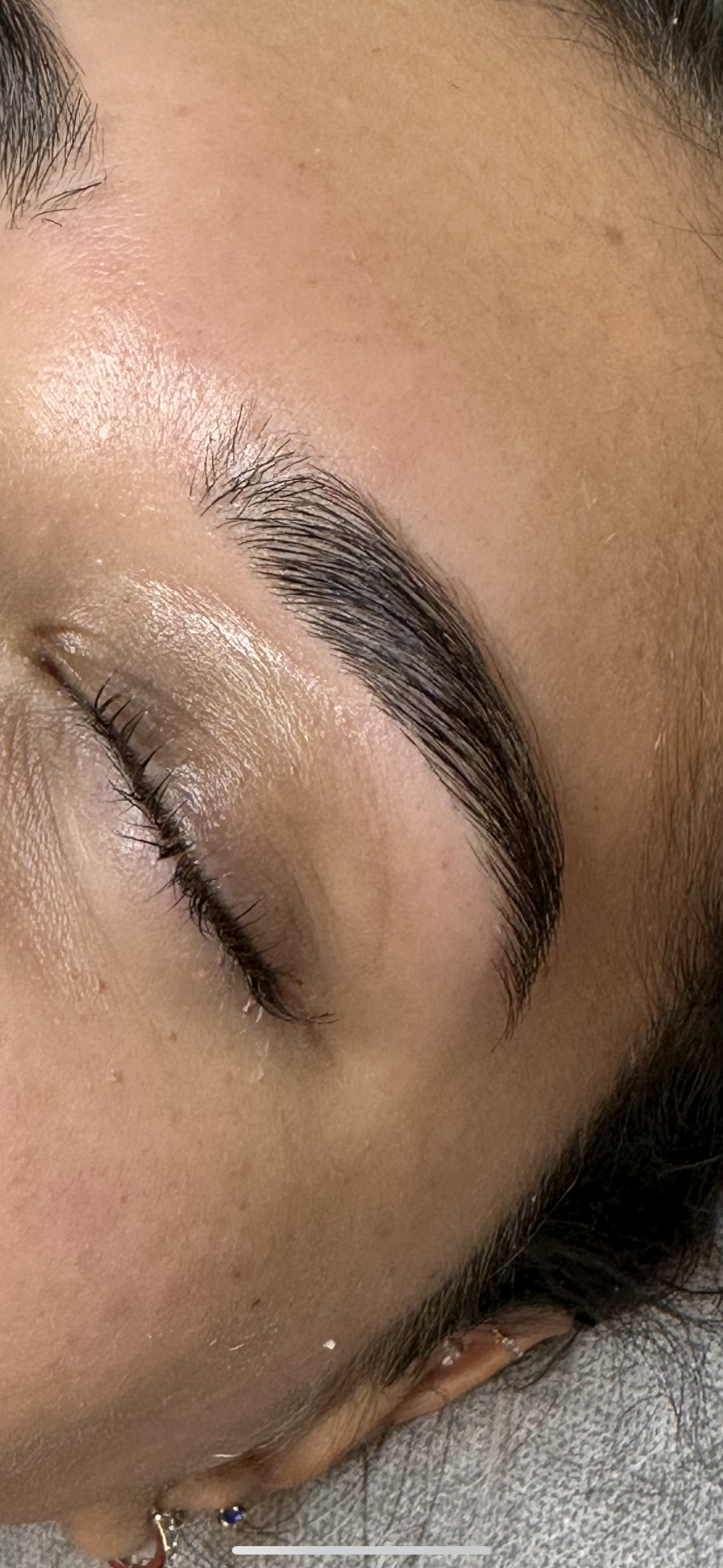 After: a fuller-looking eyebrow with hairs brushed upward into a defined arch.