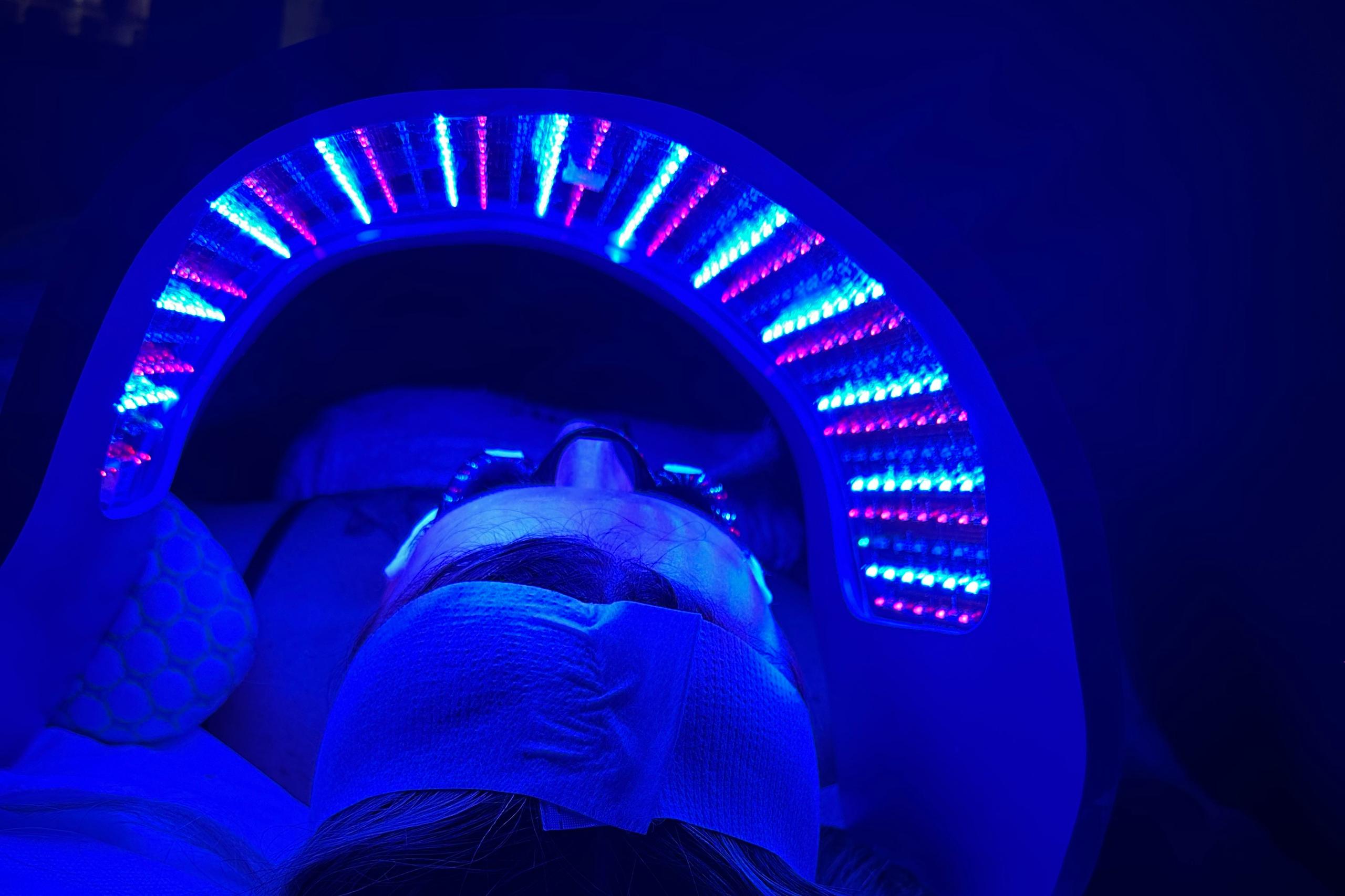 A person receiving LED blue light therapy