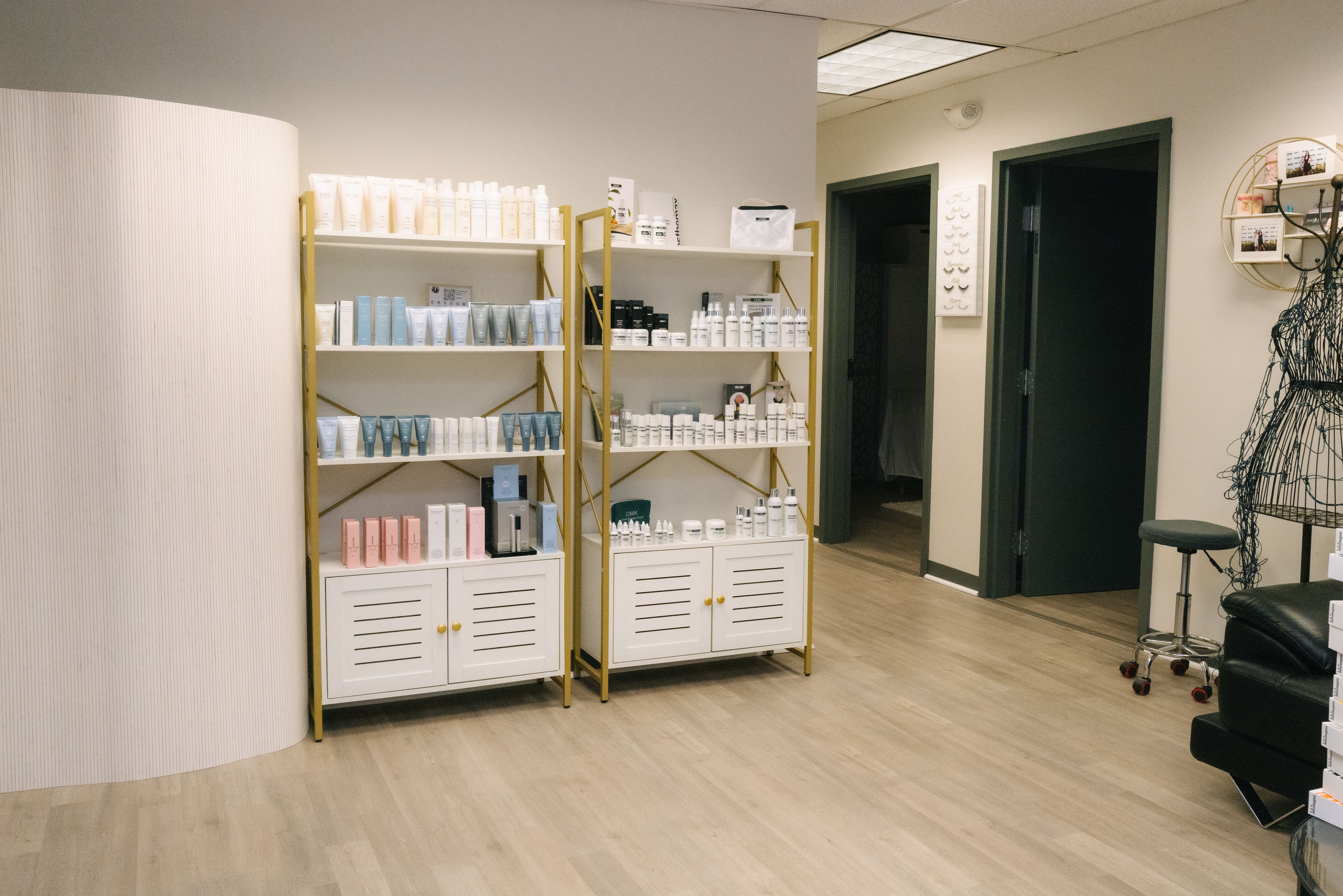 Skincare display shelves beside the treatment-room entrances at Beauty Republic.
