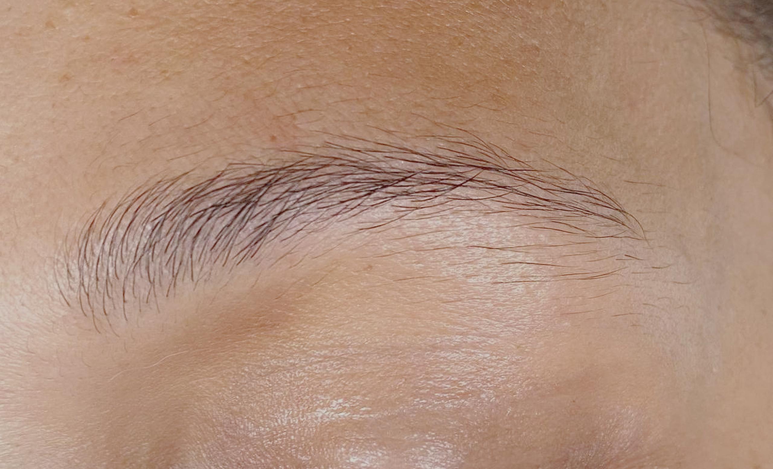 Closed eye and eyebrow of a person