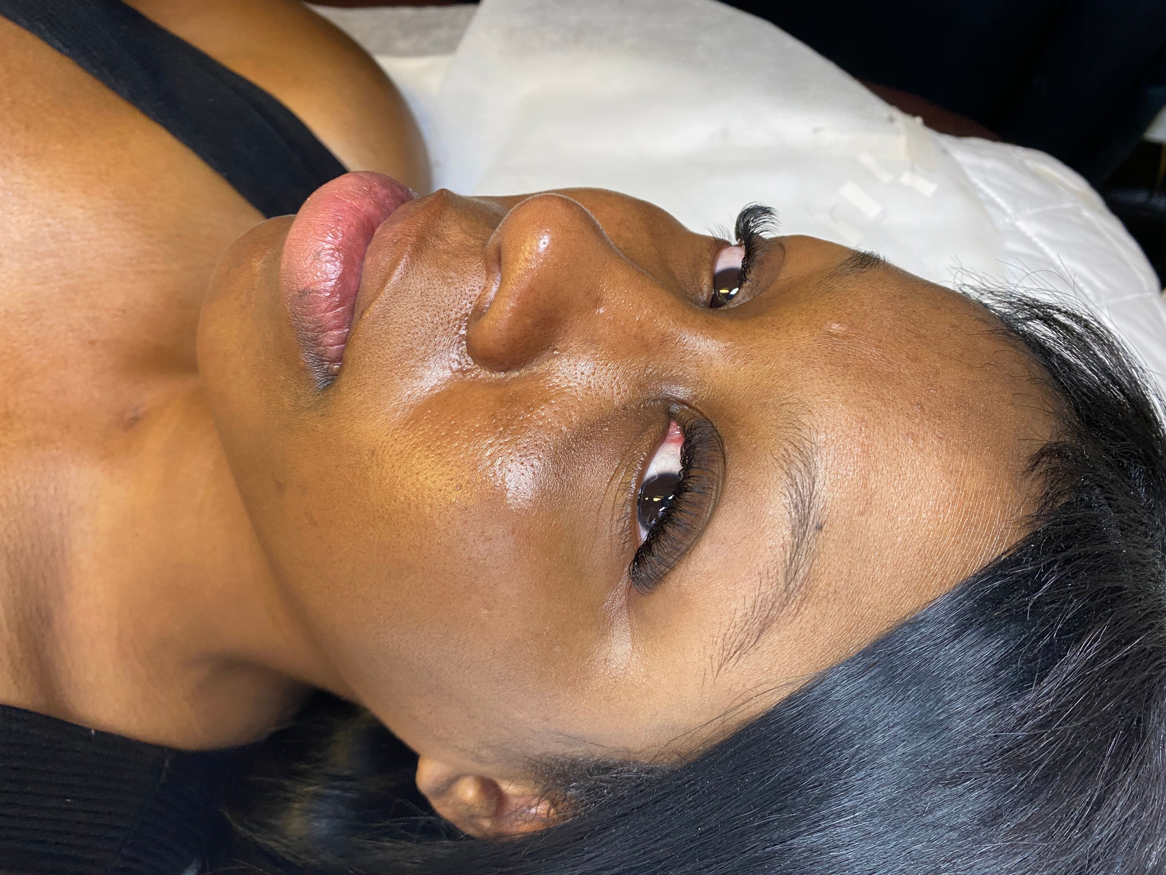 Client with full, curled eyelash extensions and longer outer lashes