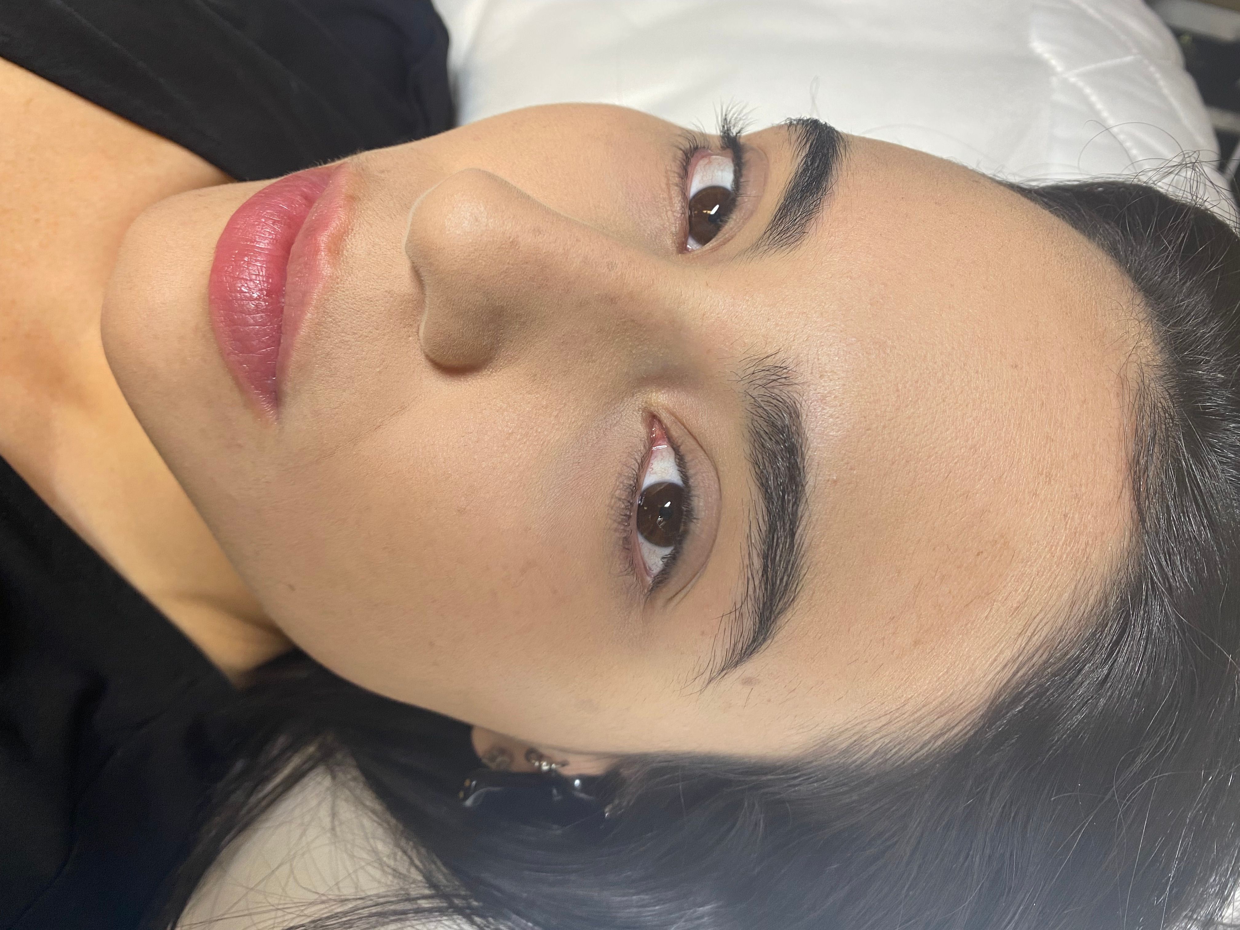 Reclining client with natural lashes before eyelash extensions