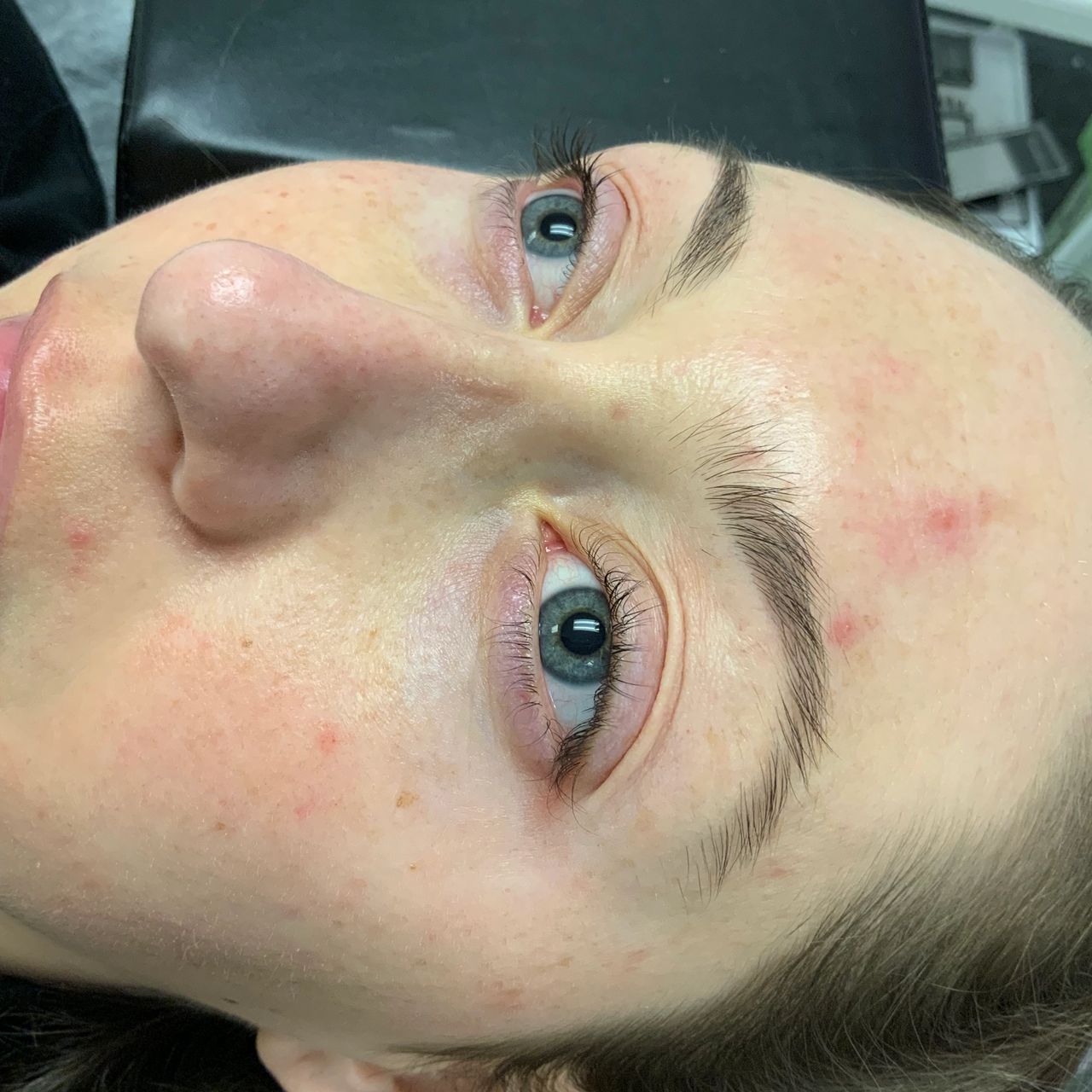 Close-up of a person's face with a blue eye.