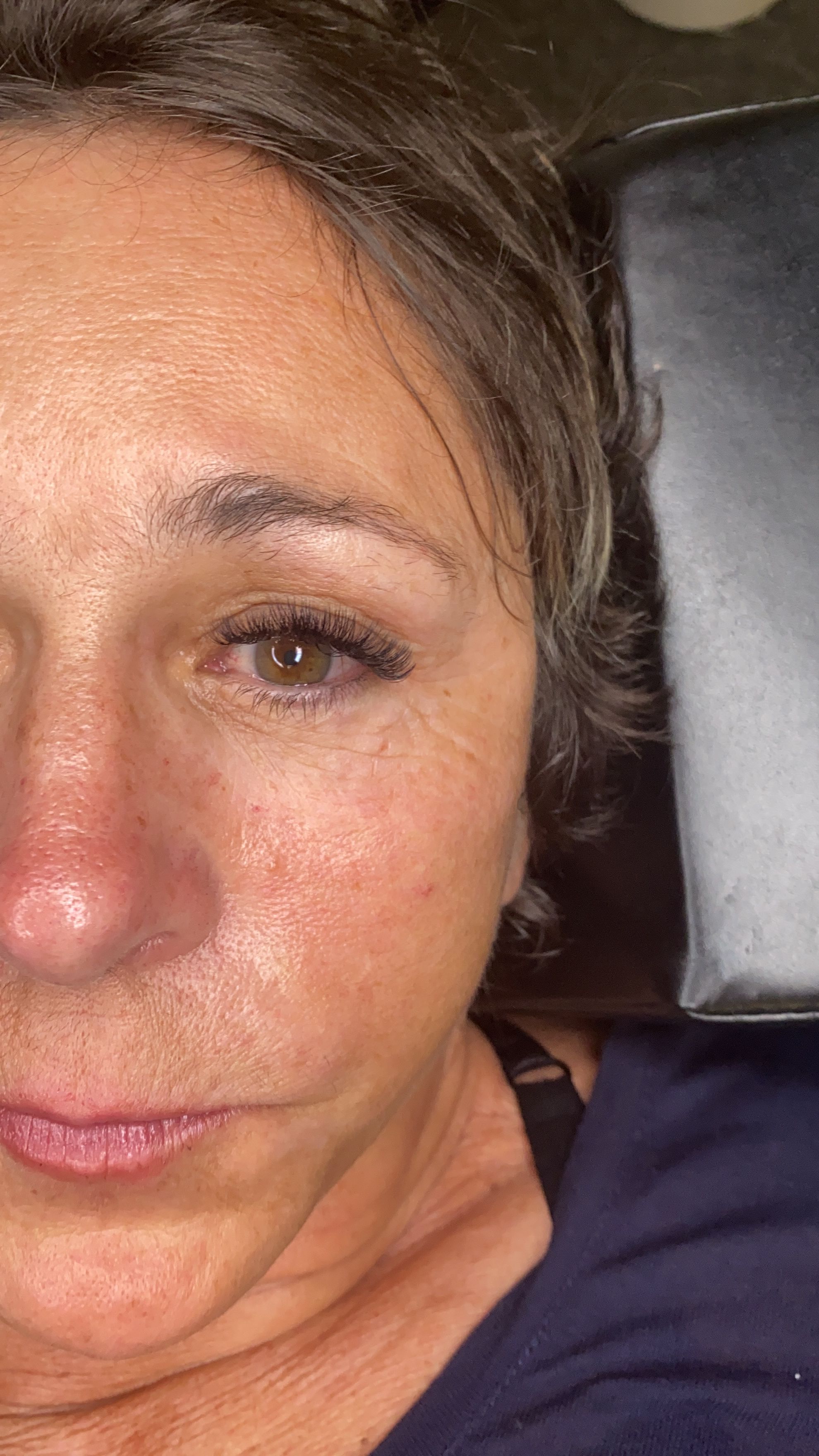 Close-up of softly fanned eyelash extensions with added length and fullness