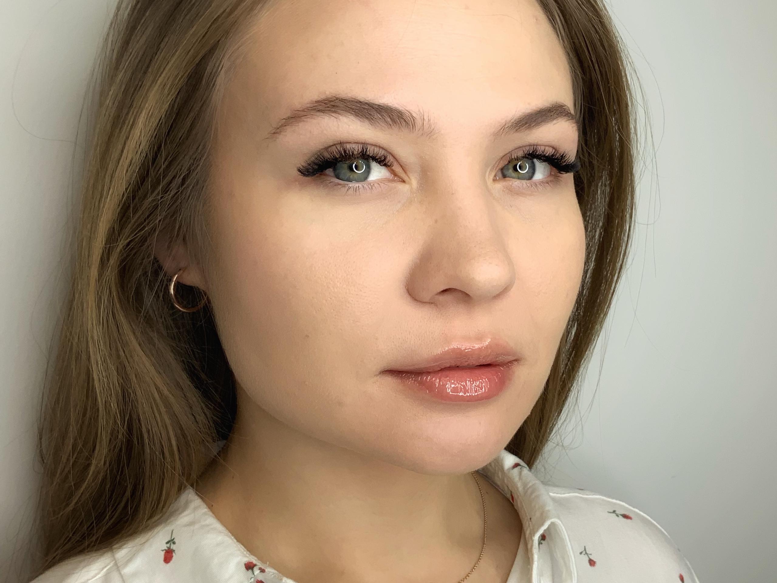 Client showing eyelash extensions after an appointment at Beauty Republic.