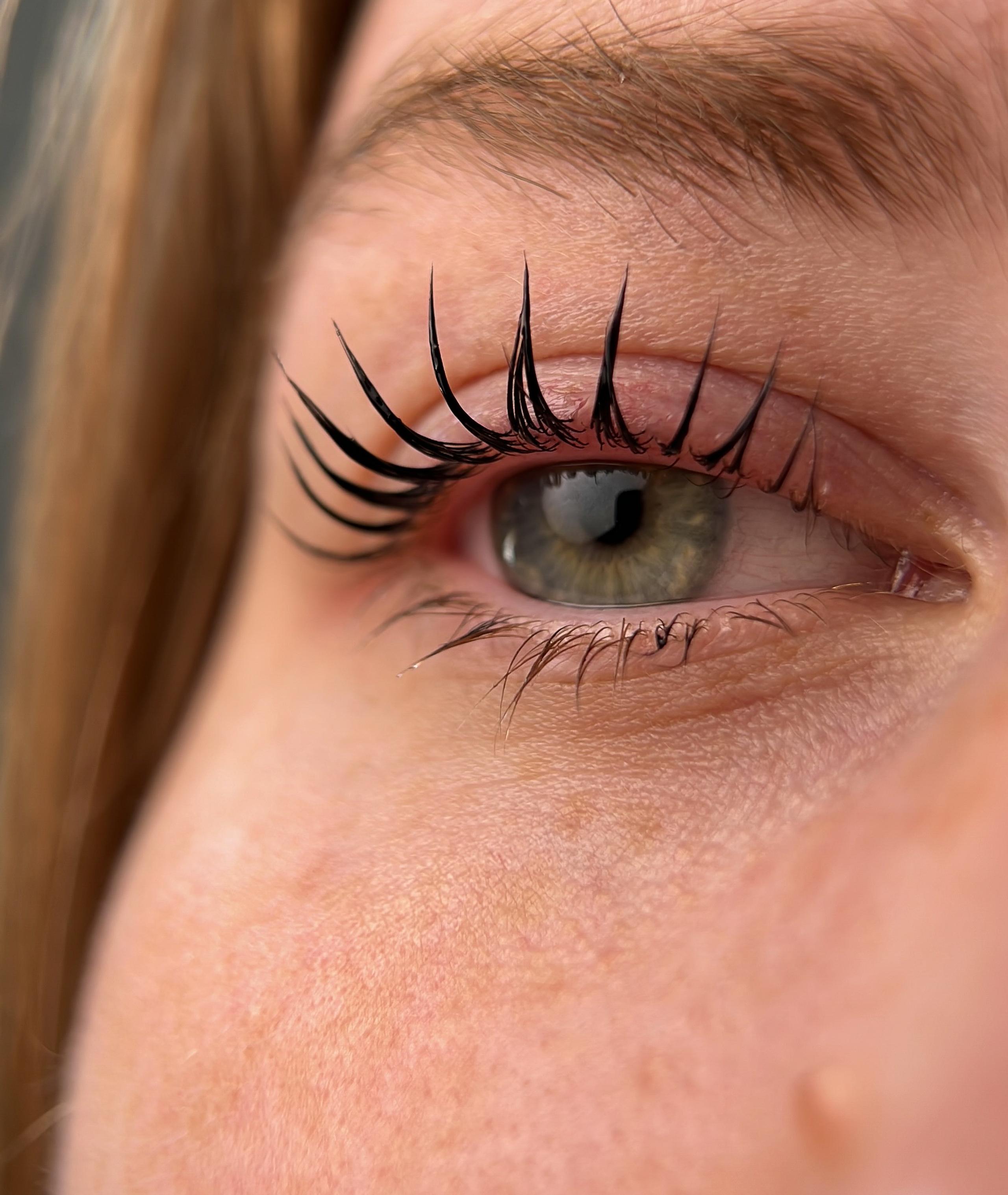 Close-up of a result of eyelash lift with darker and curlier lashes