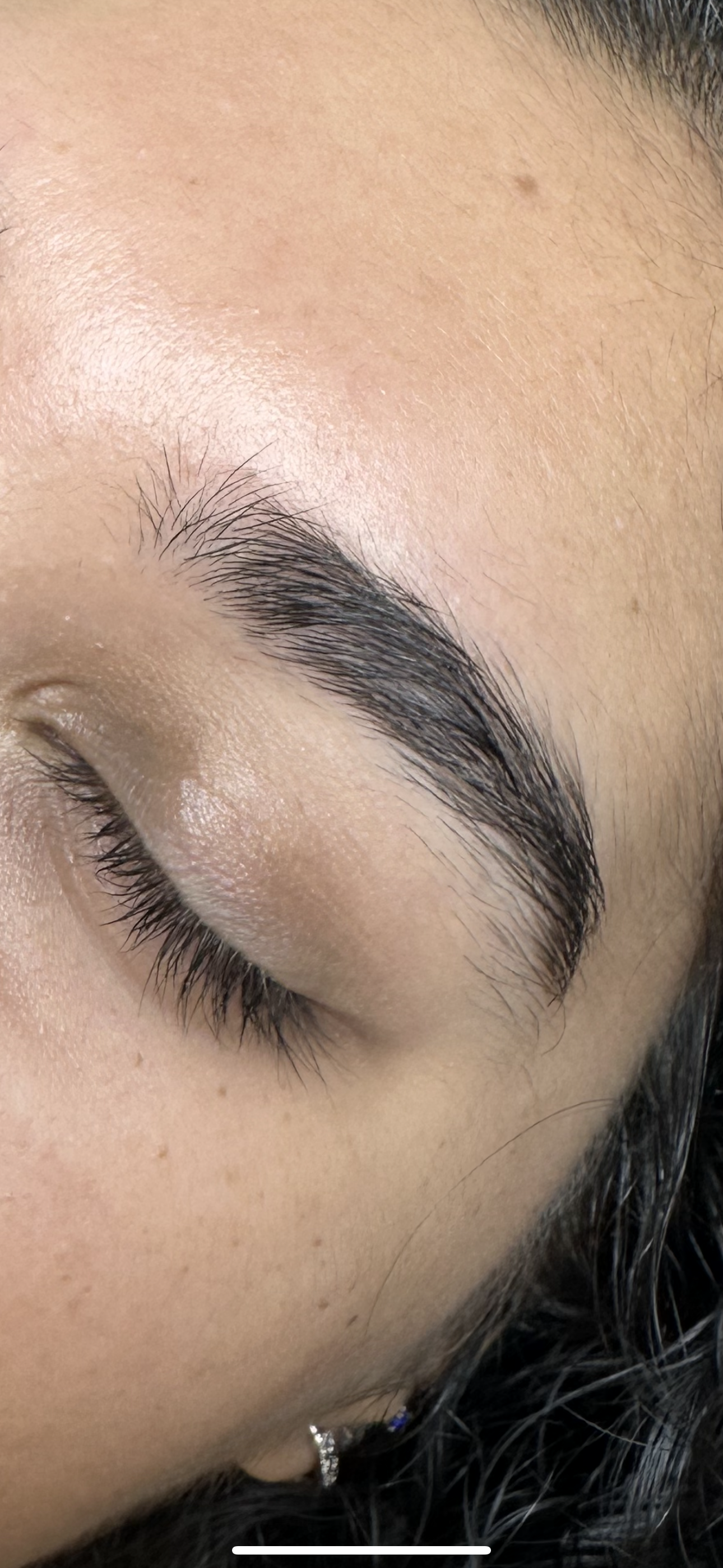Before: a naturally full eyebrow with hairs growing in different directions.