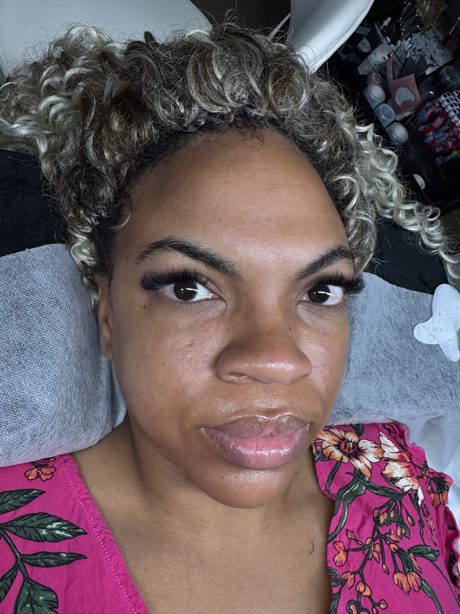 Close-up of dense, curled eyelash extensions with a full lash line
