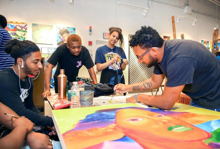 Painting Mentor and AFH teen artists at work