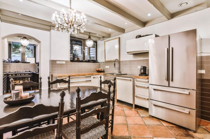 Custom mosaic tile flooring installed in a Cottage Grove home kitchen