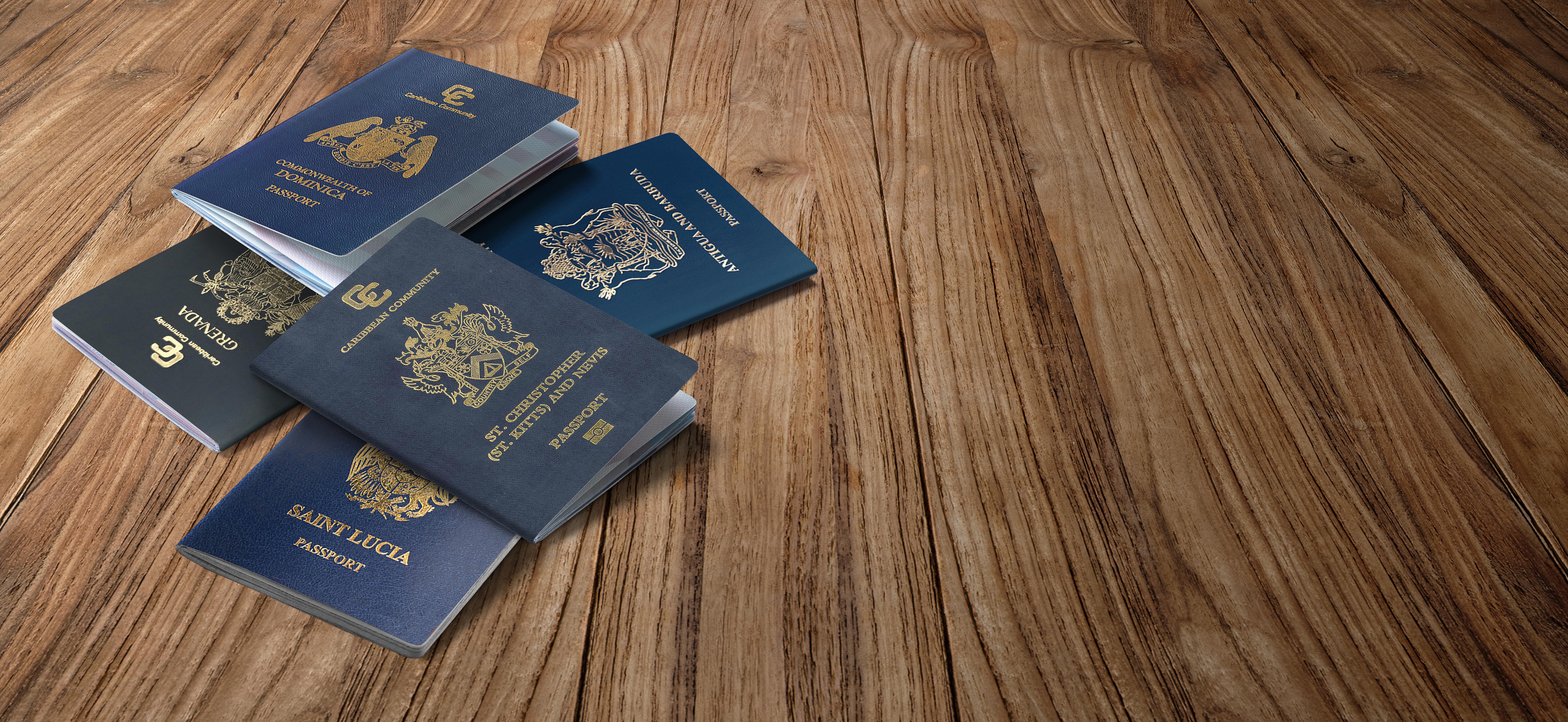 remote-application-process-in-citizenship-by-investment-caribbean nation Caribbean passports on a wooden table