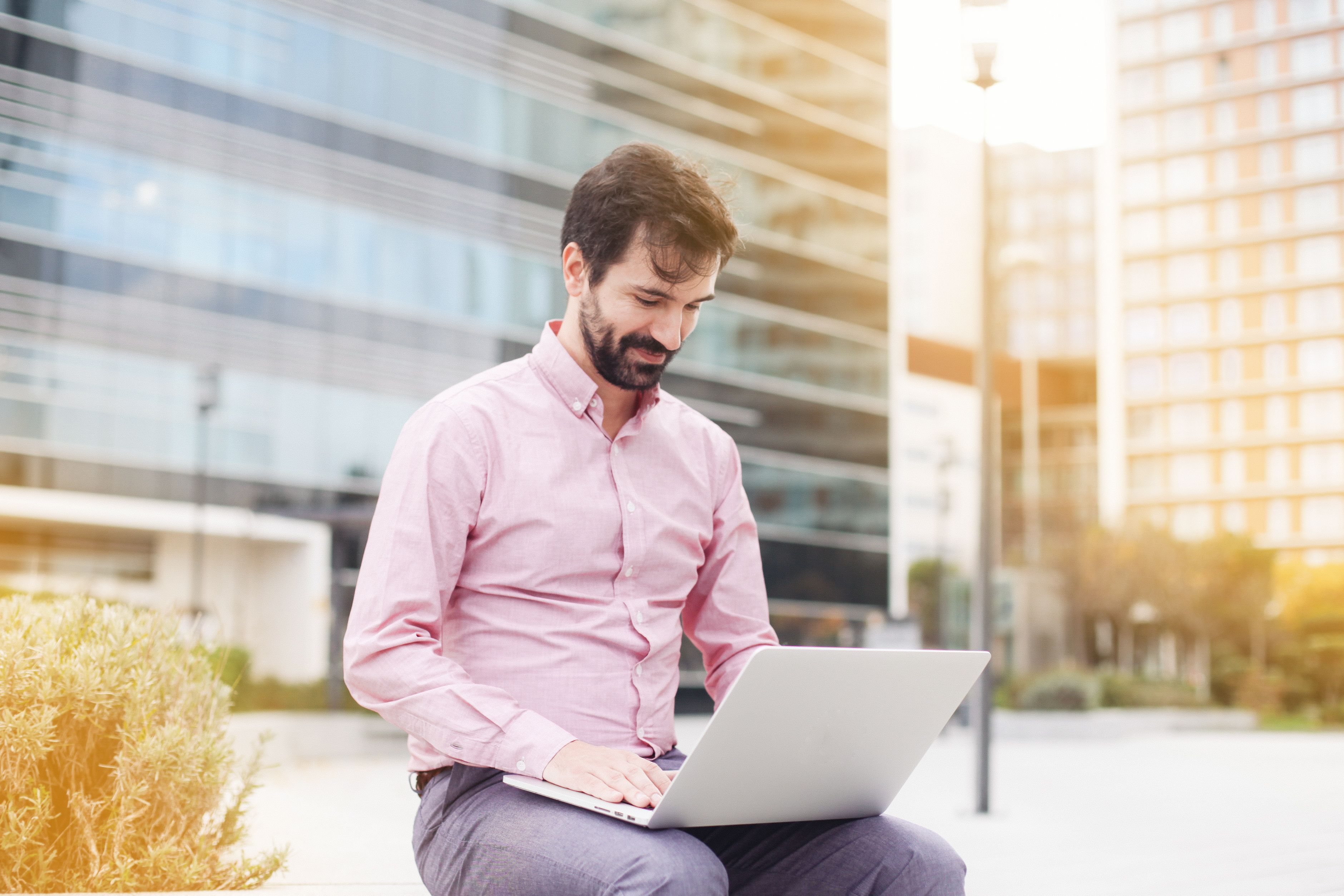 Man with a laptop remotely working