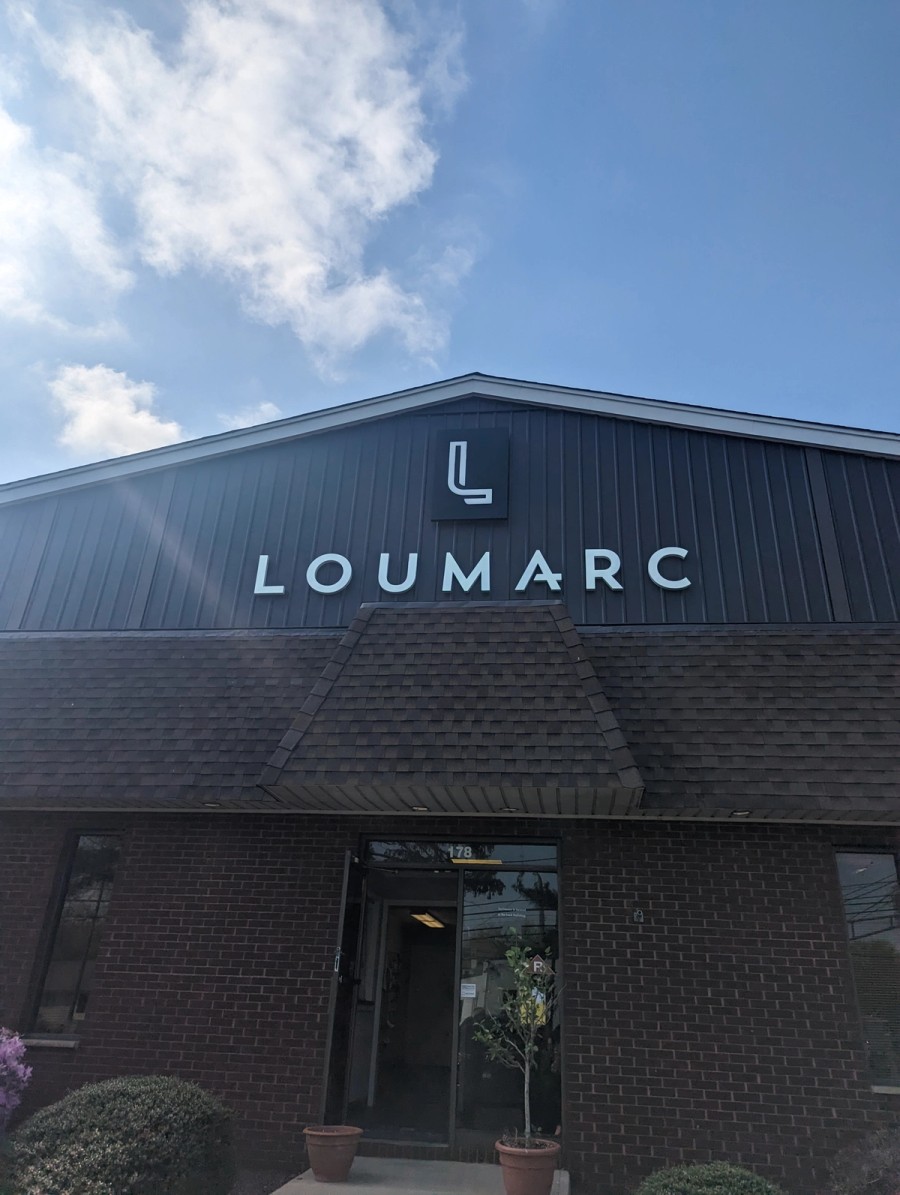 Photo of the new Loumarc Signs logo and sign on the front of the Loumarc Signs building!