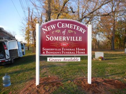 Post and panel sign for New Cemetery of Somerville