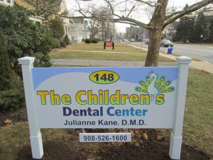 Carved sign for The Children's Dental Center