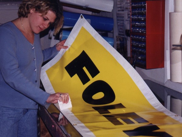 Teri working on a Foley banner