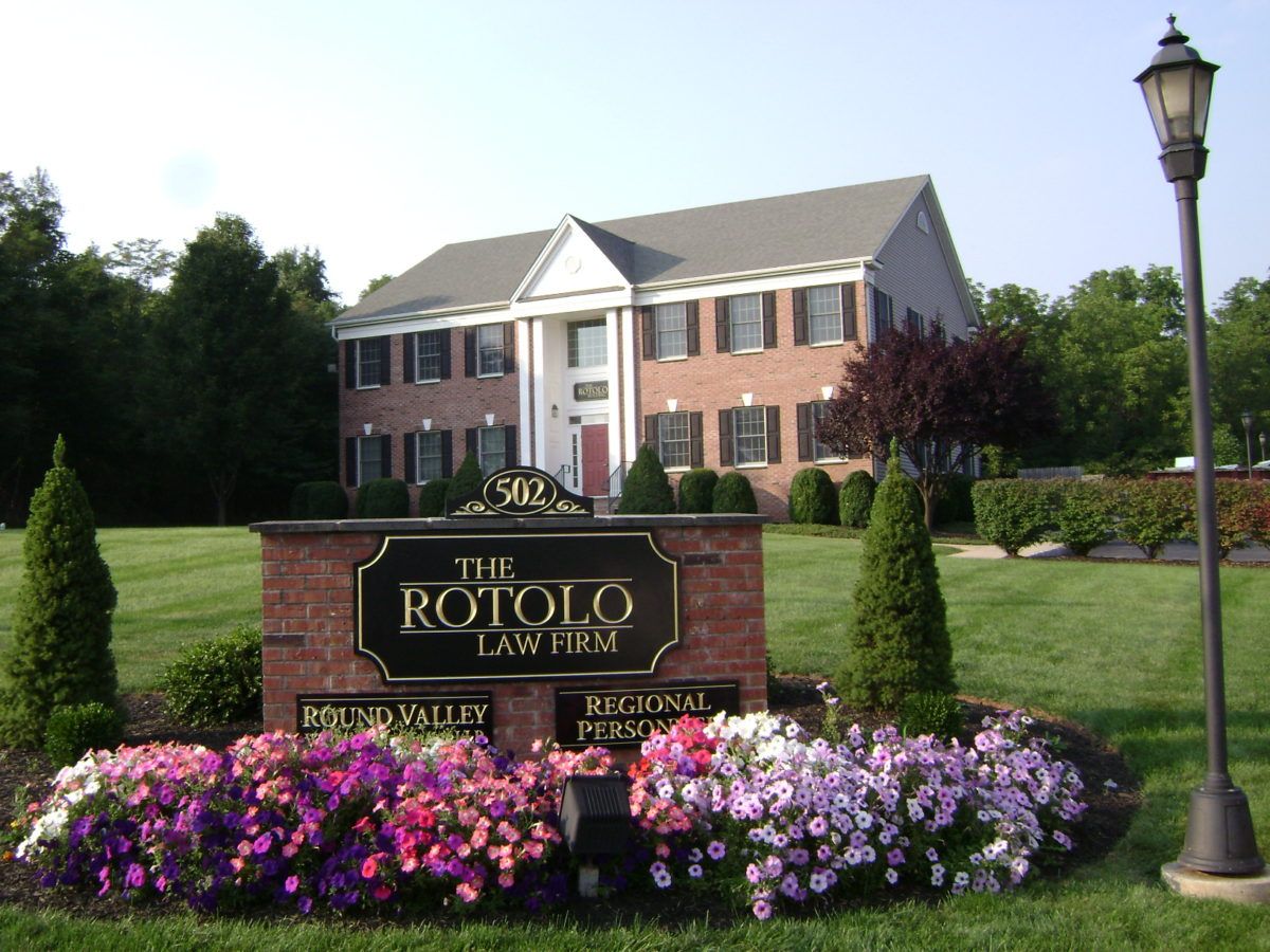 Carved sign for The Rotolo Law Firm