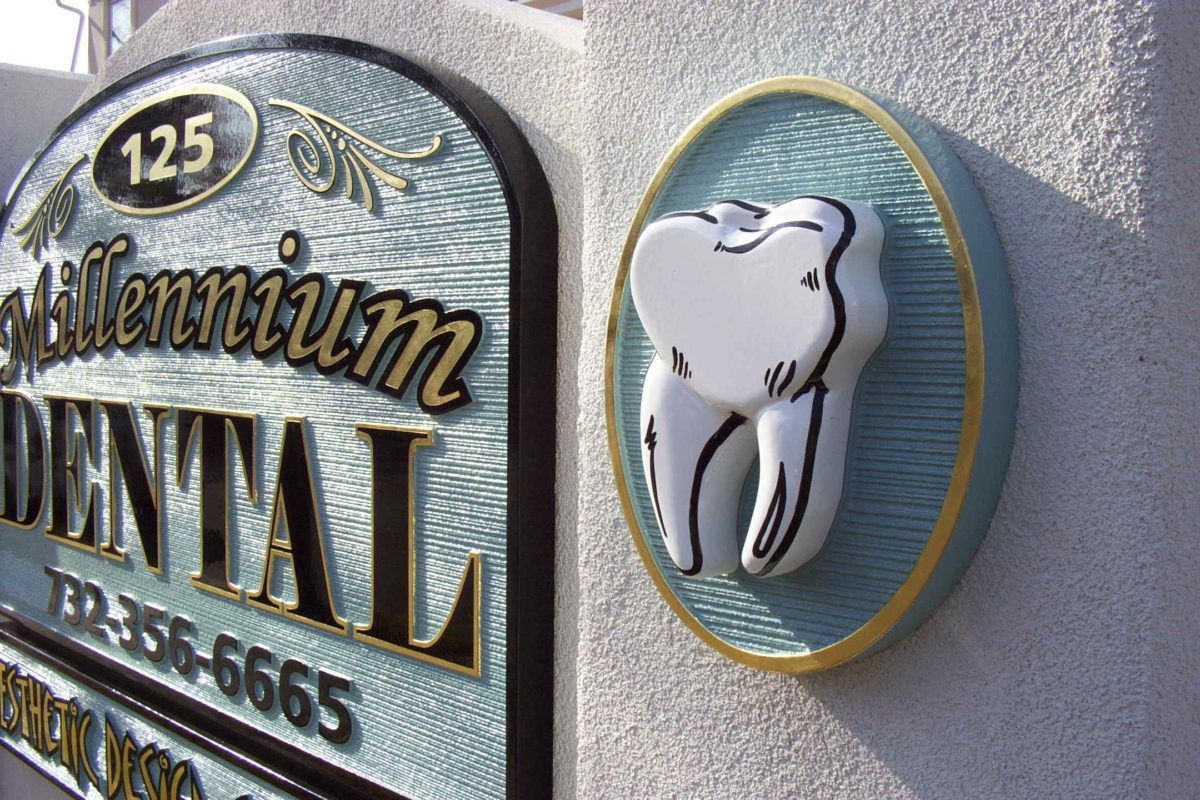 Millennium Dental custom sandblasted sign
