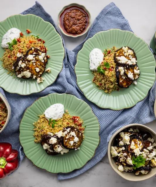 Harissa aubergine with balkan cheese, yogurt sauce and couscous