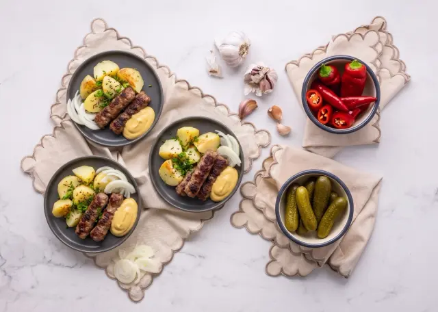 Ćevapi with Boiled Potatoes, Fresh Chives, Mustard and Pickles