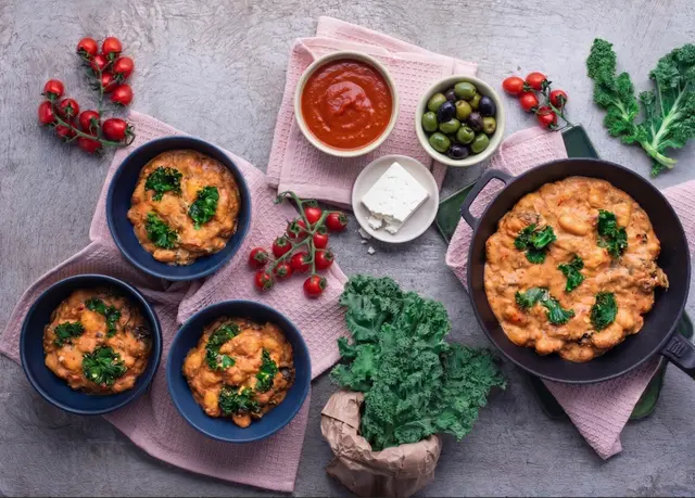 Gnocchi in Tomato Sauce with Olives, Kale and Balkan Cheese