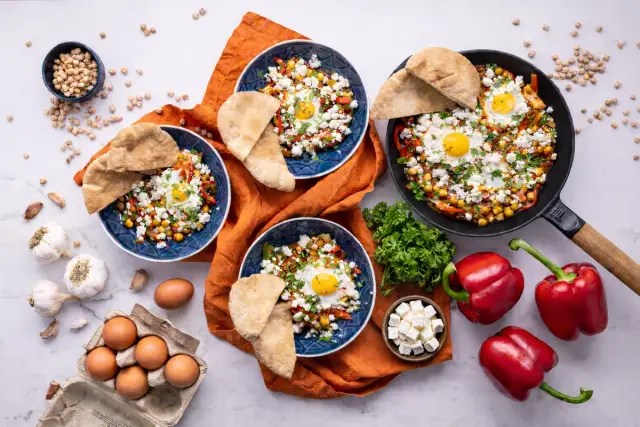 Shakshuka with Eggs, Chickpeas, Balkan-style Cheese and Pita