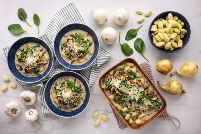 Gnocchi in Parmesan Sauce with Spinach, Mixed Dried Mushrooms, and Pine Nuts