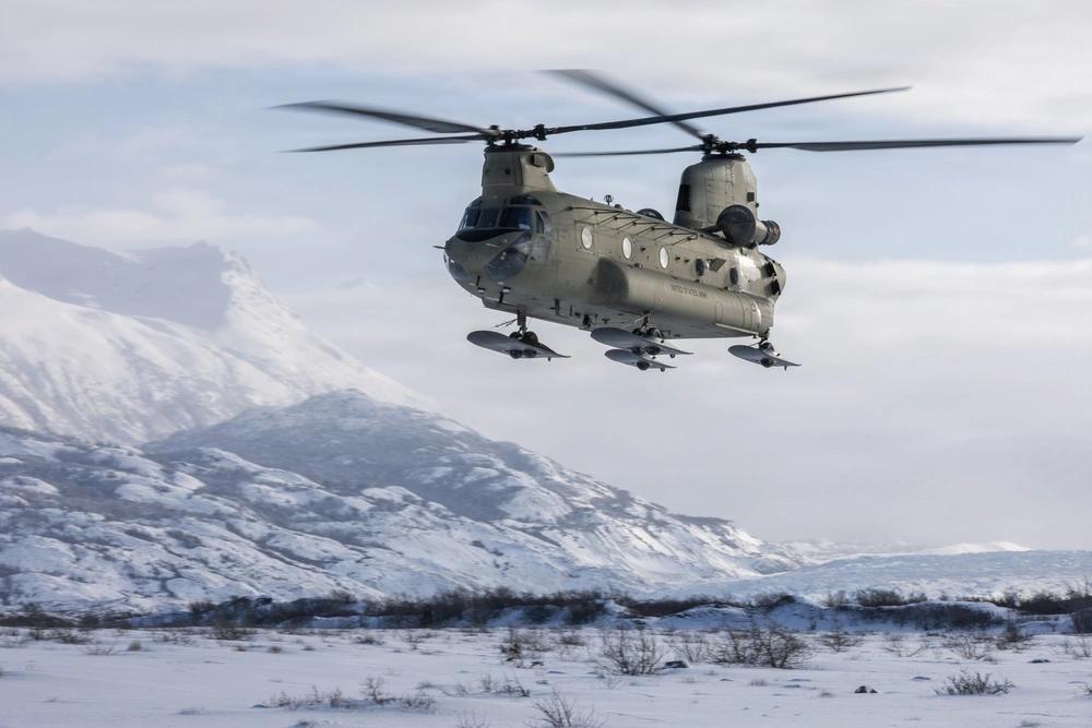Chinook Helicopter Landing In Snowy Mountain Terrain