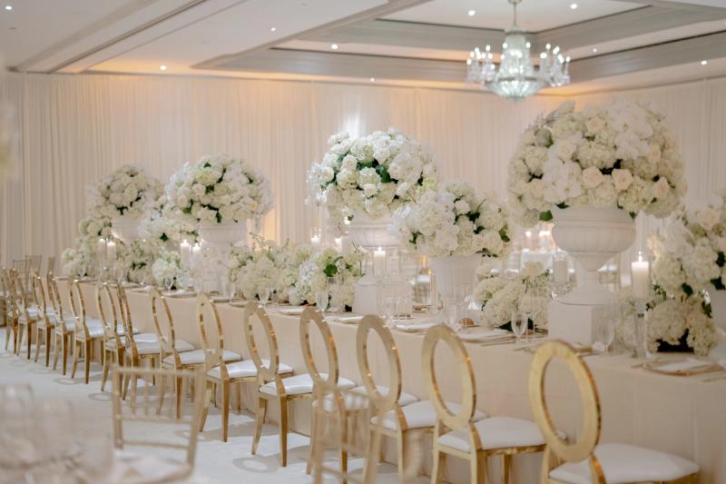 Ballroom reception at the Ritz-Carlton in Atlanta, long tables with tall white urn arrangements