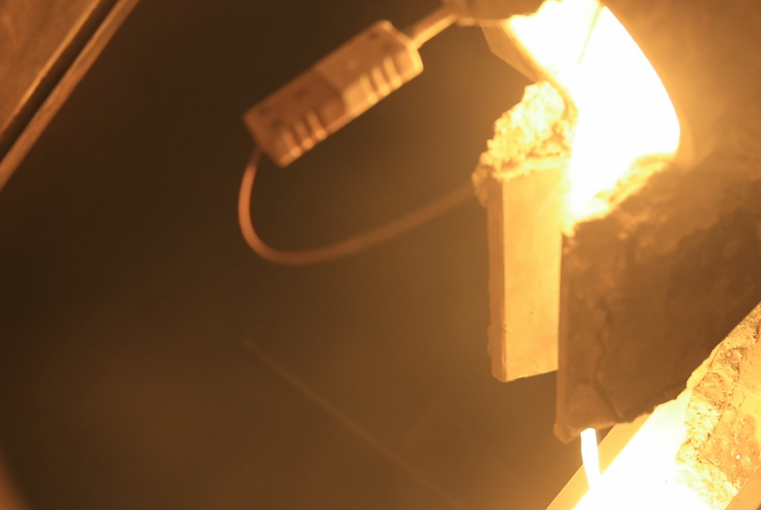 Molten metal pouring into a mould