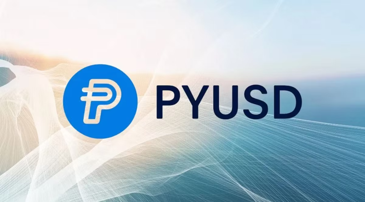 Blue logo with stylized "P" next to "PYUSD" text on a light, abstract background with white and blue gradient lines.