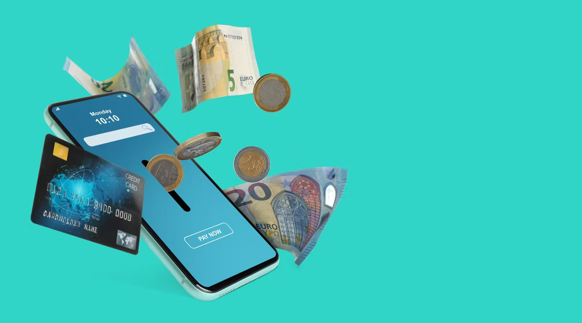 A smartphone showing a Pay Now screen, with a credit card, euro banknotes and euro coins floating around it on a turquoise background.