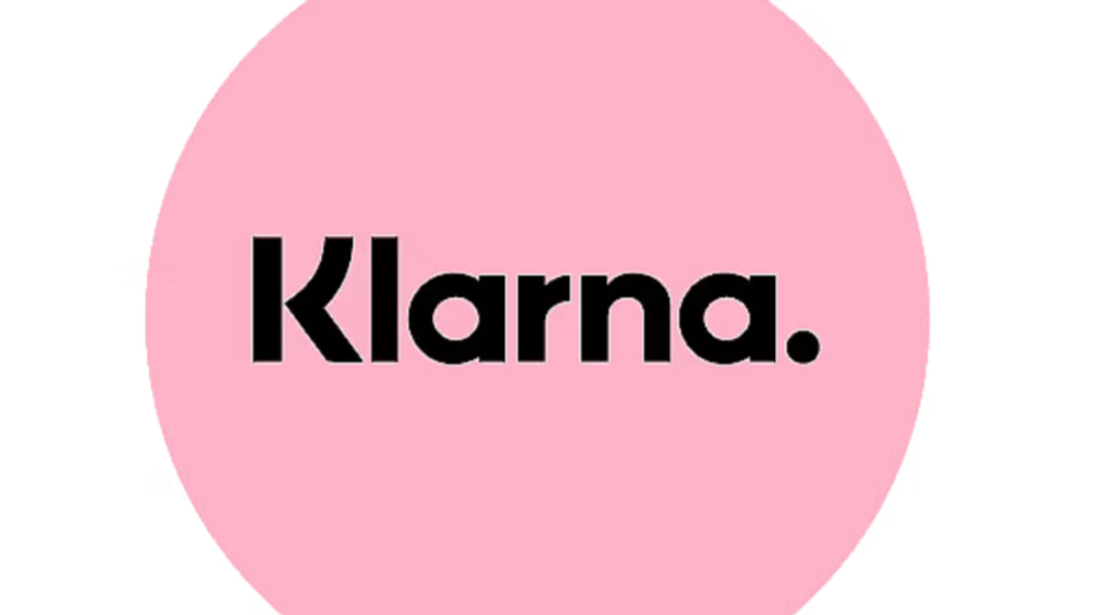 The Klarna wordmark in black on a pink circle, on a white background.