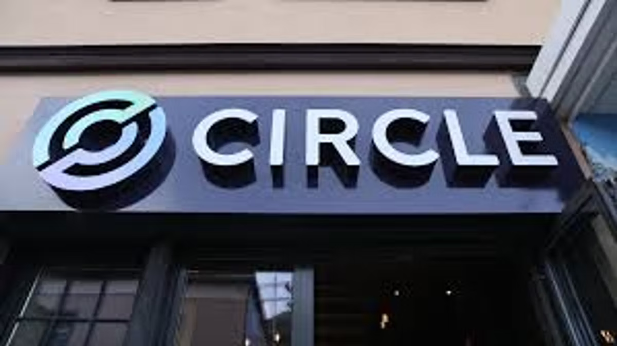 The Circle logo and wordmark on an illuminated sign above a shopfront.