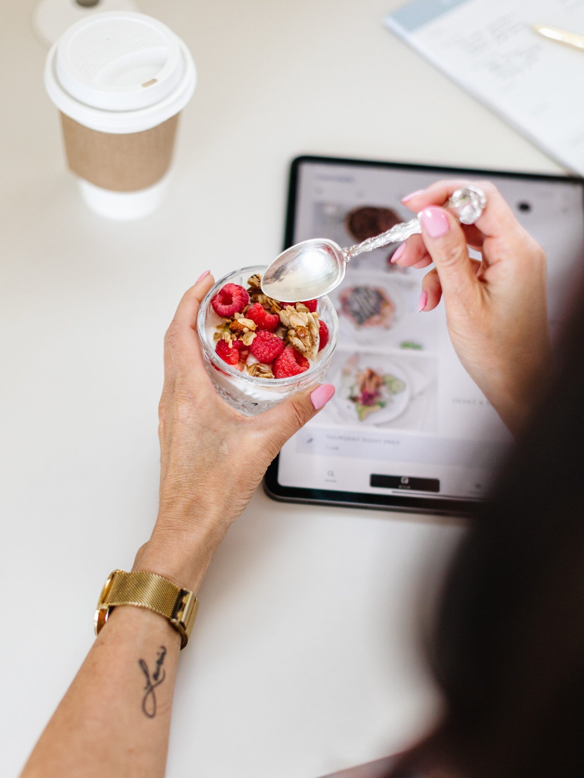 Jar of yogurt, granola and berries