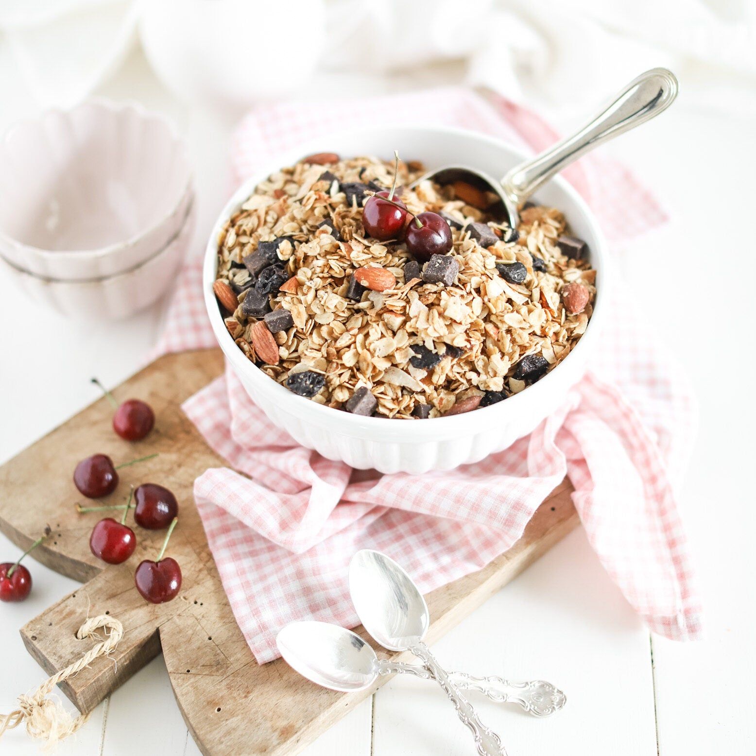 granola in a bowl with cherries