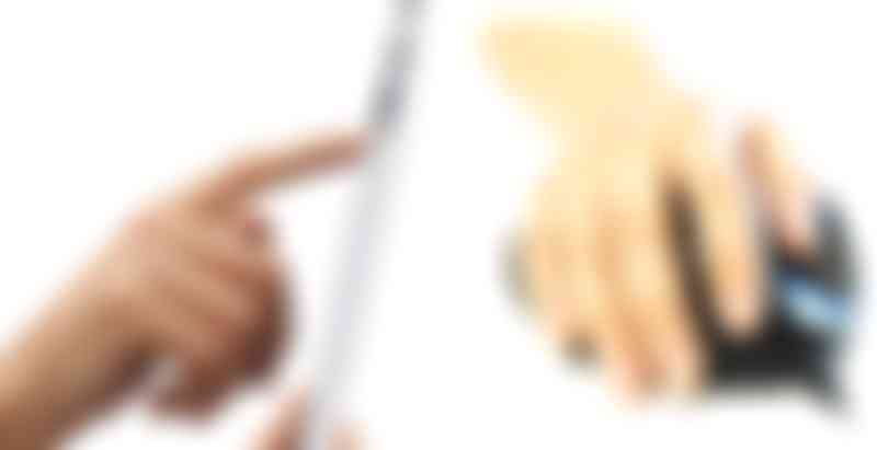 Two people drawing with different input devices