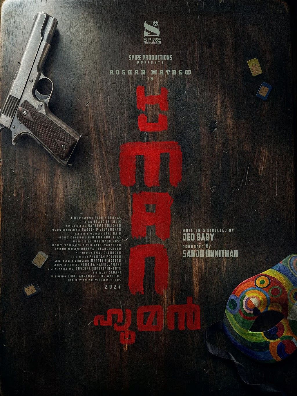 Human title poster with a pistol, scattered bullets and red title lettering