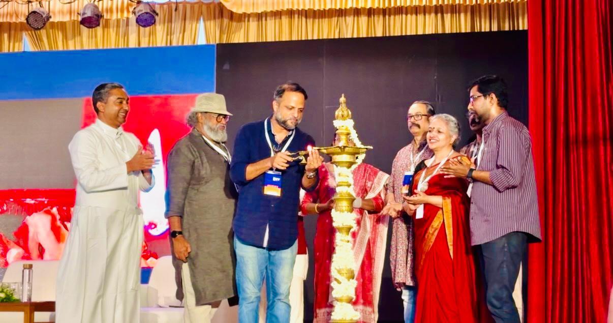 Jude Anthany Joseph lights the ceremonial lamp on stage to open the MACTA-Rajagiri International Film Festival in Kochi