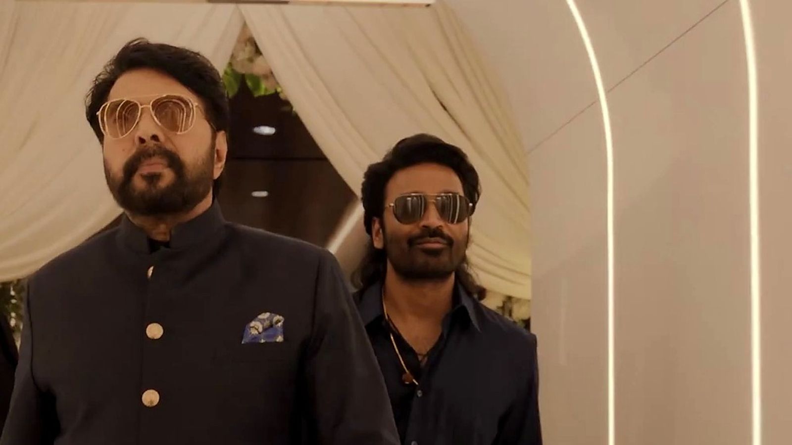 Mammootty and Dhanush in black outfits in a still from the OM teaser