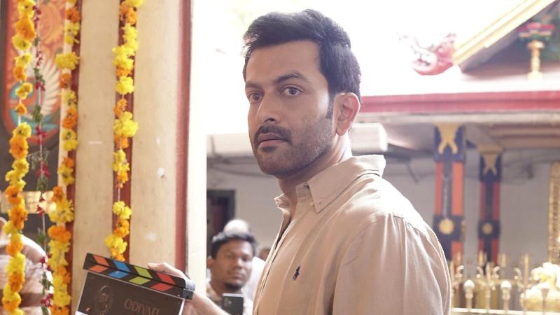 Prithviraj Sukumaran holding the clapboard at the pooja of Odiyan: The Age of Illusion