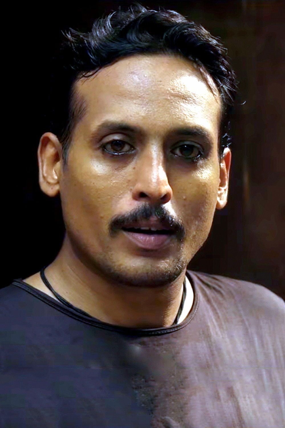 Sujith Shanker with a moustache in a dark T-shirt, portrait